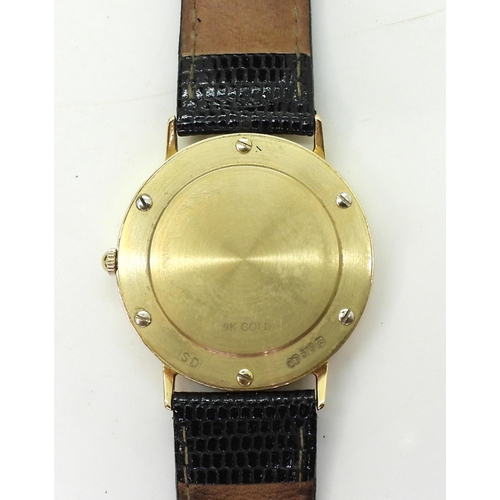 742 - A gents 9ct gold Rotary Elite in original box with papers, weight with strap and mechanism 30.6gms