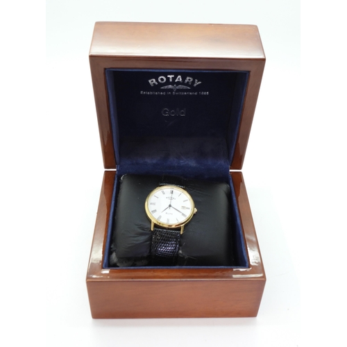 742 - A gents 9ct gold Rotary Elite in original box with papers, weight with strap and mechanism 30.6gms