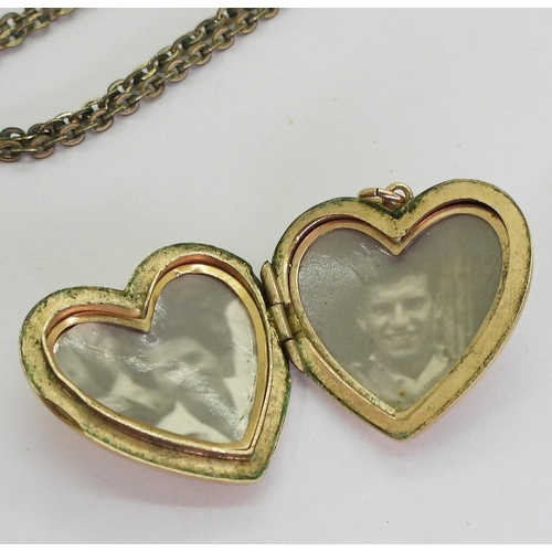 744 - A heart shaped back & front locket, weight 4.6gms a yellow metal keepsake locket with  buck... 