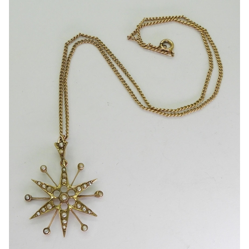 748 - An Edwardian 9ct gold star pendant set with pearls, hallmarked Birmingham 1912, on a 41cm yellow met... 