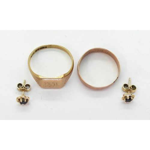 749 - A 9ct gold signet ring, size V, a 9ct rose gold wedding ring, size S1/2 and a pair of sapphire flowe... 