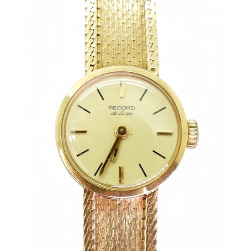 755 - A ladies 9ct gold Record De Luxe, with integral strap, length 18.5cm, weight 21.7gms