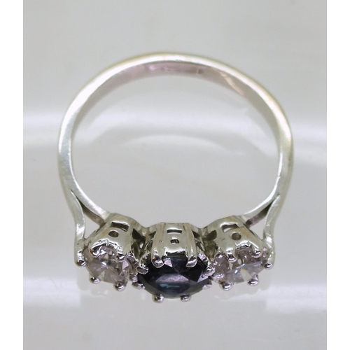 756 - A sapphire and diamond three stone diamond ring, mounted in white metal, estimated approx diamond ca... 