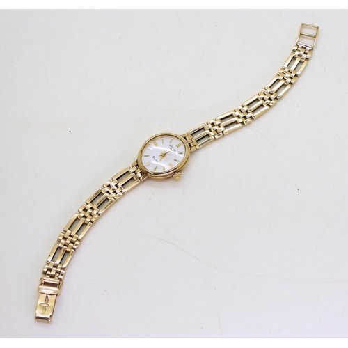 761 - A 9ct gold ladies Rotary Elite wrist watch,Length as is 15cm,  (with extra links) weight includ... 