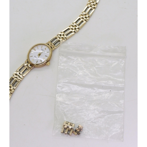 761 - A 9ct gold ladies Rotary Elite wrist watch,Length as is 15cm,  (with extra links) weight includ... 