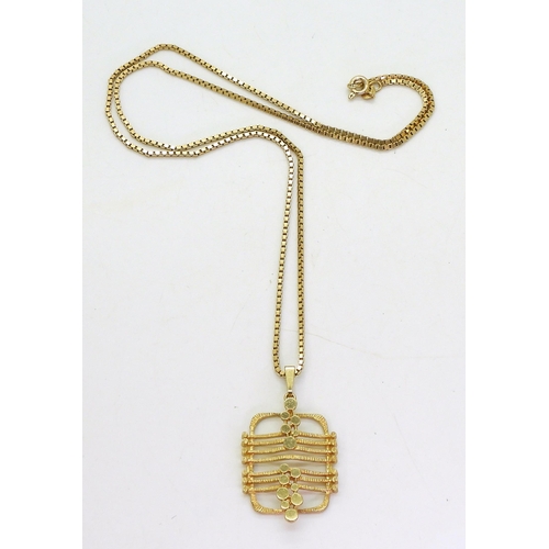 767 - A 9ct gold retro pendant, with London import marks for 1973, on a 55cm 9ct gold box chain, weight 11... 