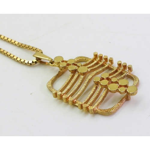 767 - A 9ct gold retro pendant, with London import marks for 1973, on a 55cm 9ct gold box chain, weight 11... 