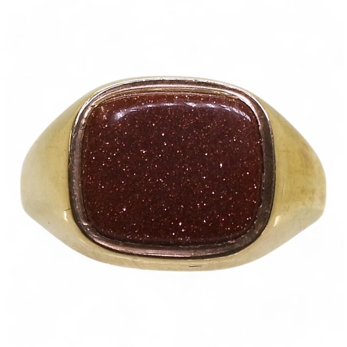 781 - A 9ct gold signet ring set with a goldstone panel, size R, weight 6.1gms