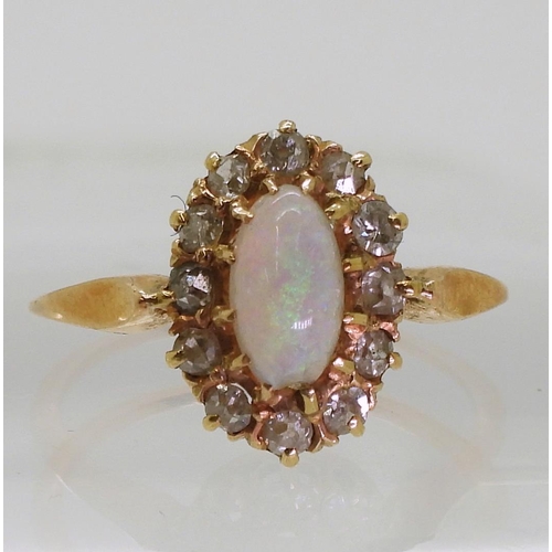 801 - A bright yellow metal opal and diamond cluster ring, size K1/2 (af) weight 2.2gms