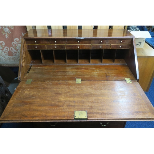 81 - A 19th century mahogany writing bureau with fall front writing compartment over four long drawers on... 