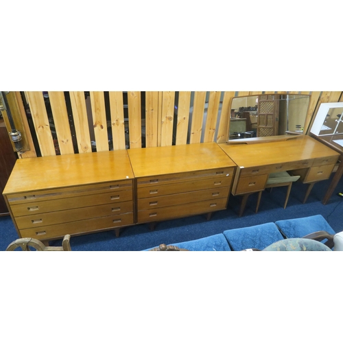 85 - A mid 20th century teak Butilux three piece bedroom suite consisting mirror back dressing table and ... 