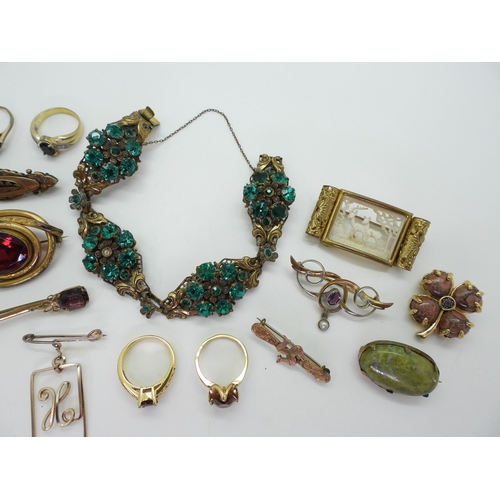 877 - A collection of vintage costume jewellery to include an early plastic deer scene, a base metal Art N... 