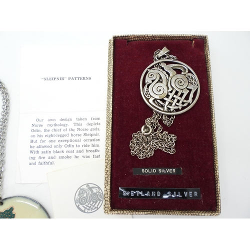 883 - A Shetland Silver Sleipnir pattern pendant and chain, in original box,  together with a further knot... 