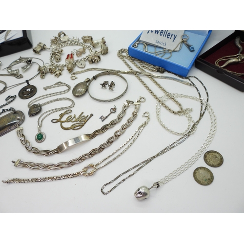 899 - A collection of silver and white metal jewellery to include a silver charm bracelet, with owl and do... 