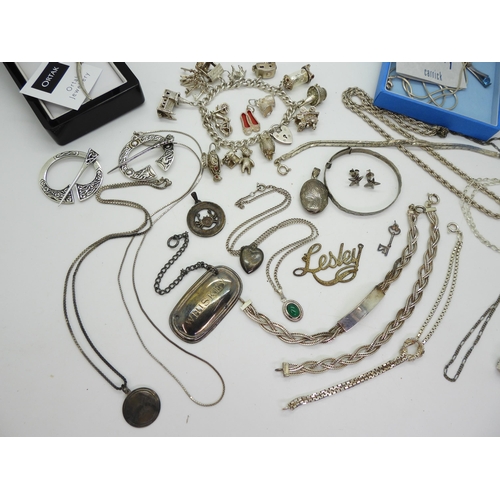 899 - A collection of silver and white metal jewellery to include a silver charm bracelet, with owl and do... 