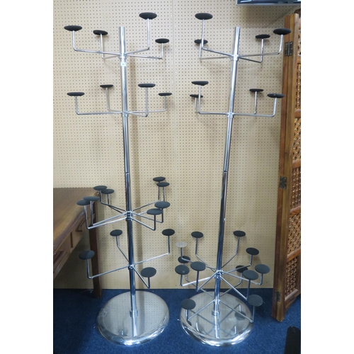 91 - A lot of two contemporary chromed commercial hat stands with twenty adjustable hat branches on circu... 