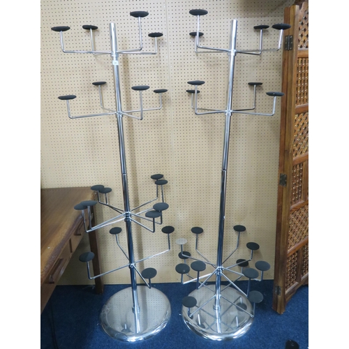 91 - A lot of two contemporary chromed commercial hat stands with twenty adjustable hat branches on circu... 