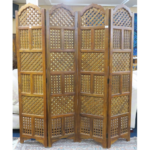 92 - A contemporary Indonesian hardwood four panel room divider with slatted panels with gilt fabric back... 