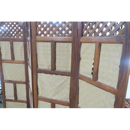 92 - A contemporary Indonesian hardwood four panel room divider with slatted panels with gilt fabric back... 