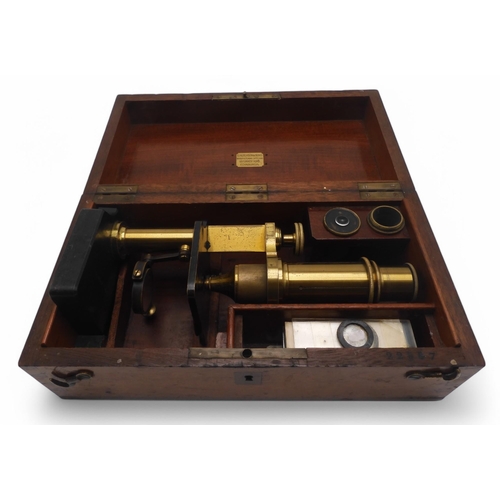 518 - A Nipon NCM mechanical calculator, serial no. 263607; and a lacquered brass monocular microscope, ho... 