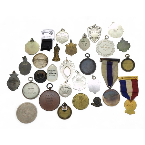 559 - A collection of sporting medals and badges, to include a 1966 Football World Cup Liaison Official's ... 