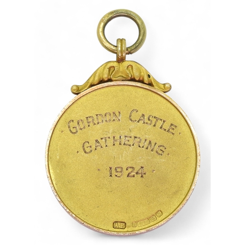 564 - A 9ct gold Gordon Castle Gathering Highland Games 1924 medal by Arthur Fenwick, Birmingham, 1924, we... 