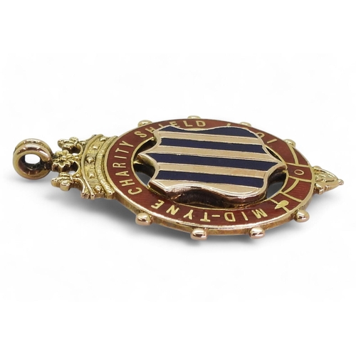 579 - A 9ct and enamel Mid-Tyne Charity Shield 1901 Winner's medal by Vaughton & Sons, Birmingham, 190... 