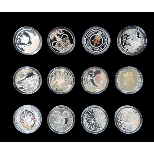 494F -  Elizabeth II (1952-2022) A lot comprising four cases of mostly silver commemorative coins... 