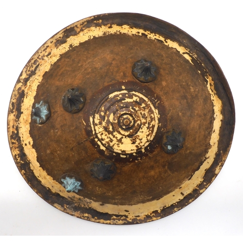 647 - An Indo-Persian leather (possibly elephant hide) dahl shield, measuring approx. 53cm in diameter; to... 