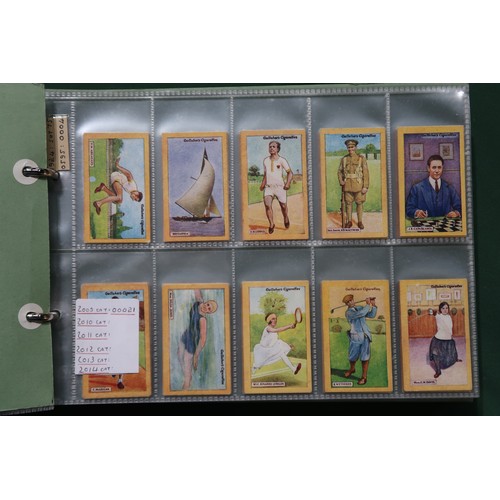 593 - A mixed collection of cigarette/collectors' cards, housed in folders, to include The Wills Portraits... 