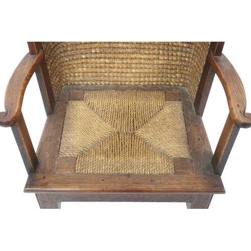 2007 - A 19TH CENTURY OAK FRAMED ORKNEY CHILD'S CHAIRwith curved rush back over drop in rush seat flanked b... 