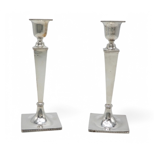 2361 - A PAIR OF GEORGE V SILVER CANDLESTICKSby Walker & Hall, Sheffield 1930, of tapering faceted form... 