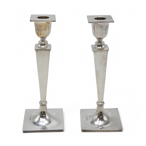 2361 - A PAIR OF GEORGE V SILVER CANDLESTICKSby Walker & Hall, Sheffield 1930, of tapering faceted form... 