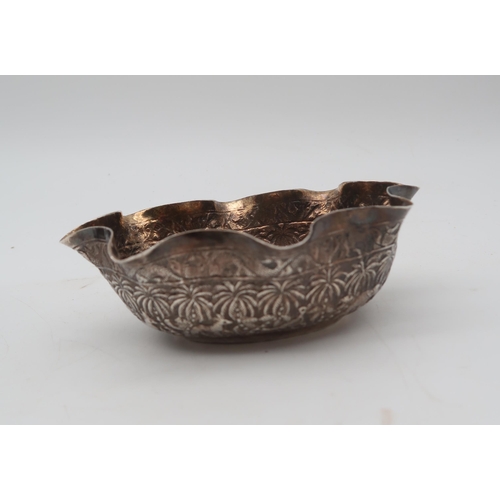 304 - A pair of Indian white metal finger bowls, with engraved decoration of animals, and another circular... 