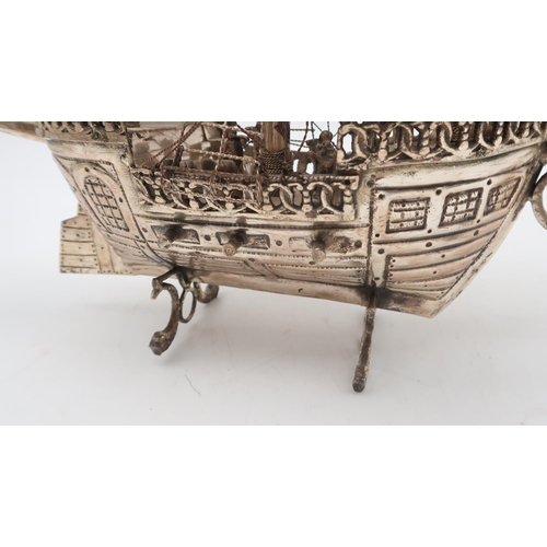 333 - A silver plated nef in the form of a galleon, on dolphin fin supports, 58 x 48cm