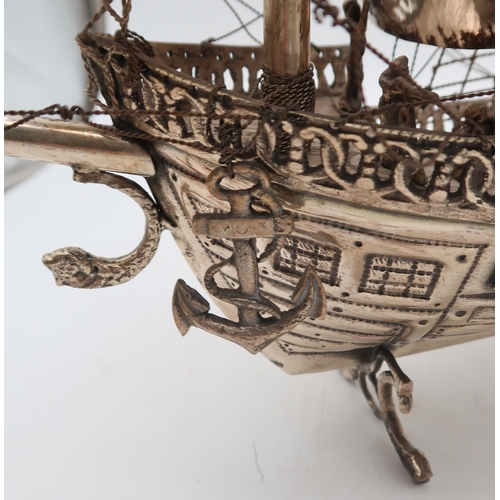 333 - A silver plated nef in the form of a galleon, on dolphin fin supports, 58 x 48cm