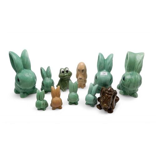 154 - A collection of Sylvac green glazed rabbits including three large models 1027 & 1028, various sm... 