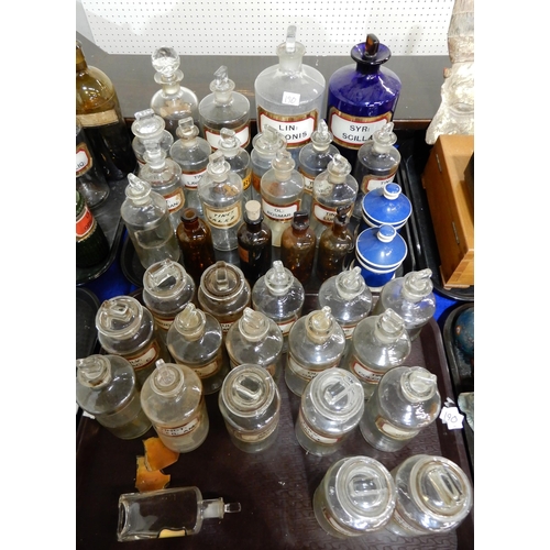 190 - A large collection of chemists bottles and jars including large blue and clear examples, brown glass... 