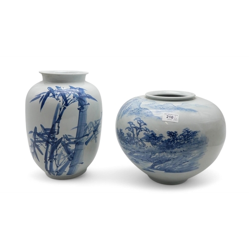 210 - Two Japanese blue and white vases, one painted with bamboo, the other a landscape