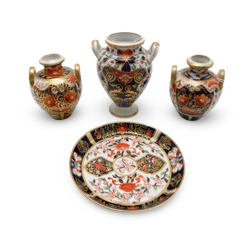 213 - Three Derby urns and a saucer