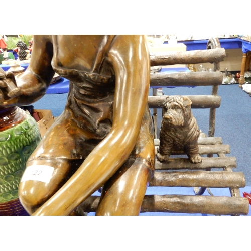 222 - A bronze sculpture of a woman and dog sitting on a bench