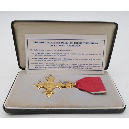 400 - A cased Most Excellent Order of the British Empire (O.B.E. - Gentlemen) badge/medal, housed in a Roy... 