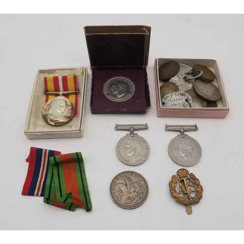 402 - A WW2 War Medal and Defence Medal, an Auxiliary Territorial Service cap badge engraved verso 