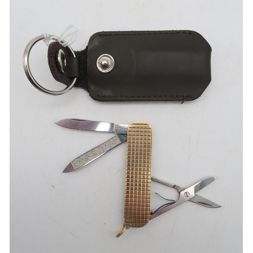 404 - A 9ct gold pocket knife, maker's mark Ramsden & Roed, London, fitted with Victorinox steel blade... 