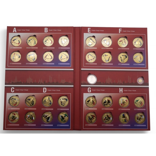 358 - A 2018 Football World Cup participant coin set, comprising thirty-two gold plated coins and a .585 1... 