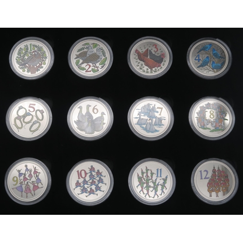 359 - A lot comprising various commemorative coins to include the 12 Days Of Christmas, Titanic  Whit... 