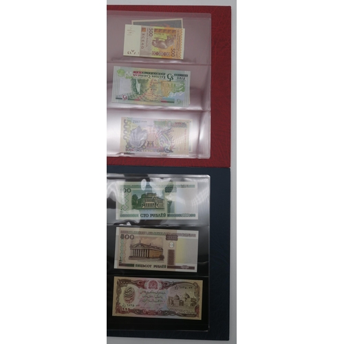 364 - A world wide collection of banknotes in three albums together with A Falklands Islands £5 1983... 