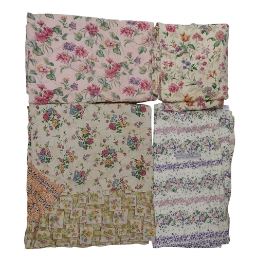 6010 - Four assorted quilts including purple and pink flowers on white ground 176cm x 164cm, pink flowers o... 