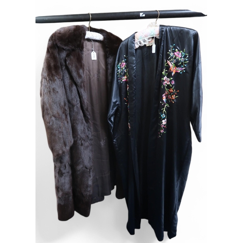 6104 - A long brown fur coat and a Chinese embroidered gown