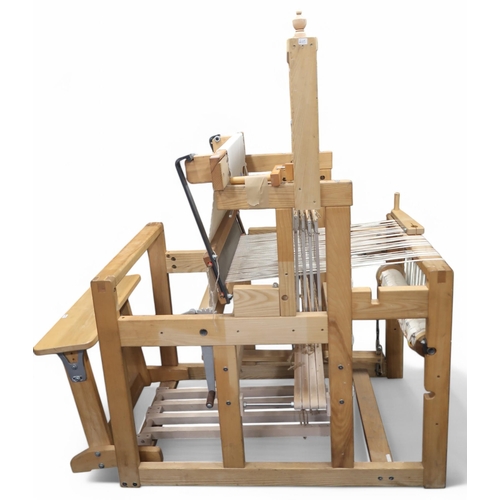 6105 - A large floor standing weaving loom and stool